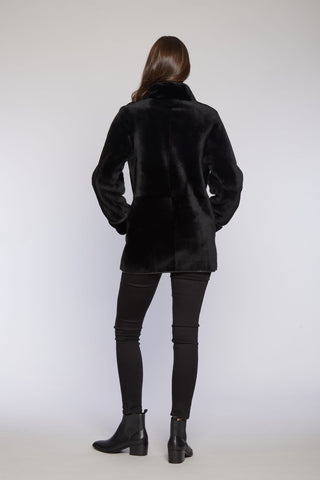 Back View of Reversible Merino Shearling Jacket in Black with Stand Collar