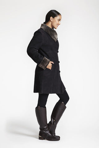 Side View of SHEARLING EASY FIT COAT WITh RAW EDGE DETAIL in Soft Black with large wing collar