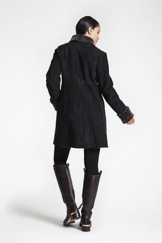 Back View of SHEARLING EASY FIT COAT WITh RAW EDGE DETAIL in Soft Black with large wing collar