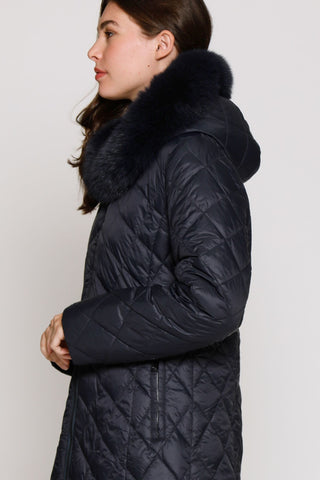 Side View of QUILTED PUFFER REVERSES TO FAUX FUR in Black with Trimmed Hood