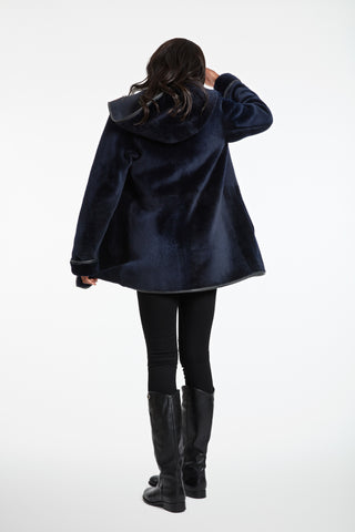 Back View of Essential Merino Shearling in Navy with hood down
