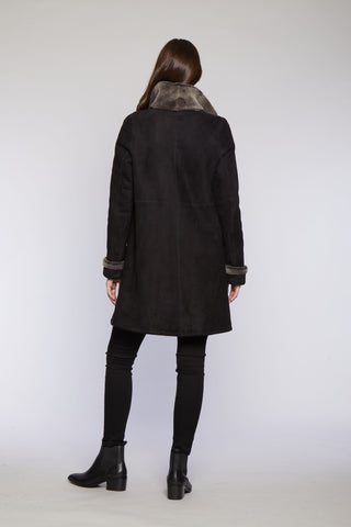 Back View of Reversible Spanish Merino Shearling Coat in Walnut with Tall double fur collar